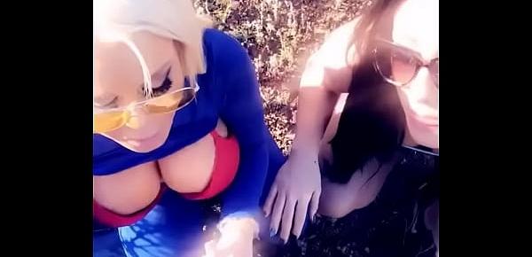  Two hot pornstars suck off a lucky fan in a public park
